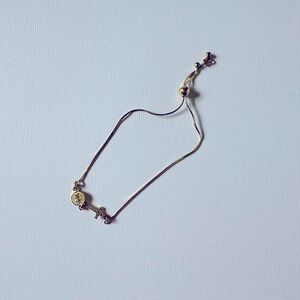 Gold cross bracelet